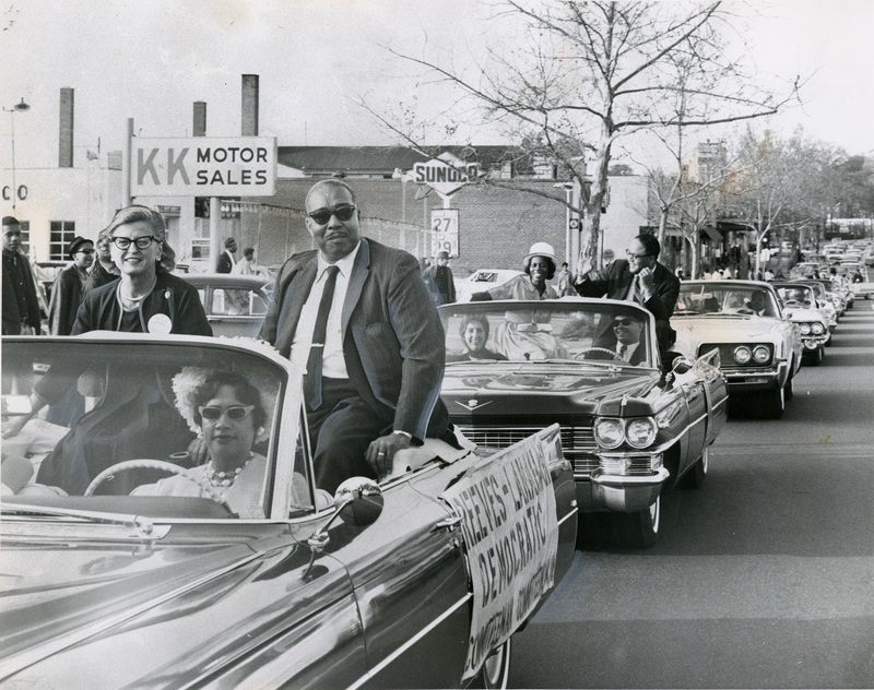 Frank Reeves and Frances “Scottie” Lanahan campaign for spots on the Democratic National Committee the day before the May 5, 1964 primary election. This was the first year D.C. residents were allowed to vote for president.